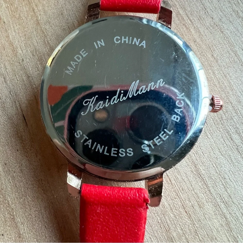 Kaidi Mann ladies rose gold tone red watch NEW BATTERY